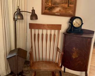 Rocking Chair, Wood Decorative Cabinet, Wood Sewing Accessory Cabinet, Brass Double Gooseneck Floor Lamp, Scenic Artwork.