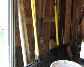 lots of shovels and outdoor tools