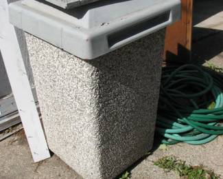 there are 2 of these stone trash bins