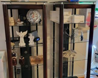 two wood and glass display towers