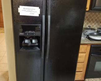 Whirlpool double door fridge with ice and water dispenser.