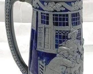 2084 - Vintage German Beer Stein w/ Lid 15" tall - features intricate, embossed decorations
