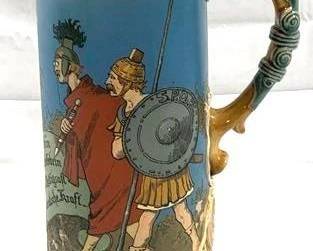 2077 - Vintage Mettlach #2095 German Beer Stein w/ lid 16" tall - made in Germany, 2.5L type: etched lid: inlay description: drinking Germans and Romans, row of medallions around base of stein, signed Schlitt