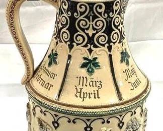 2107 - Vintage Marzi & Remy German Beer Stein w/ lid 16" tall - features relief decorations, including months of the year and scenes of peasants dancing