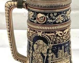2085 - Vintage German Beer Stein w/ lid 17.5" tall - features an intricate design