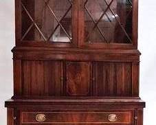 9280 - Hepplewhite Inlaid Tambour Secretary flaming mahogany, brass finials w/ eagle eagle adorned brass hardware, eagle inlaid center door, bookcase top, flip out surface, tapered legs, with key 77 x 36.5 x 19