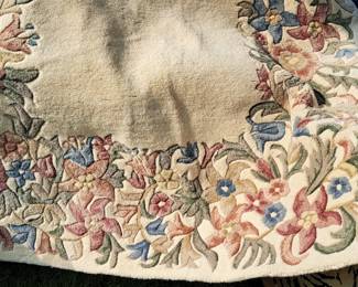 100% wool sculpted floral rug -.pastel shades with beige open center approx 5'x8' $50