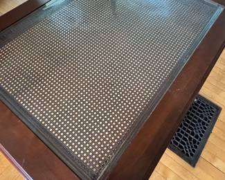 Antique Ethan Allen coffee table and has wheels.