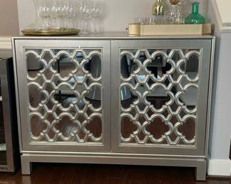 Modern metallic cabinet with mirrored door panels