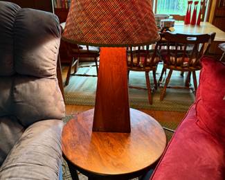 round table with very mid century lamp.