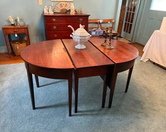 Wonderful banquet table.  Early 19th century.  The ends can be used as a round table or fully extended with center table dropleaves will seat at least 12.  Signed Ironstone tureen with original ladle.  Pair of brass candlesticks.  The rug is for sale also.