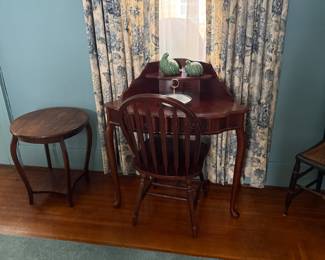 Actually this nice desk or vanity also fits nicely into a corner.  Chair goes with it.  C. 1940 round side table.