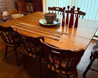This wonderful table convets to a bench when pegs removed.  Several Townsend Implement yard sticks.  Set of five armless maple chairs.  Two  matching captain's chairs.