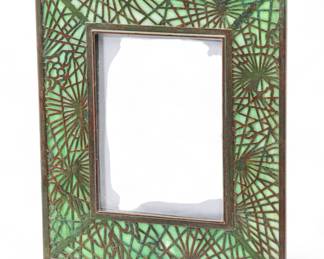 Lot 93 | Tiffany Studios (American) 'Pine Needle' Etched Metal & Favrile Glass 947 Photo Frame, Early 20th C. H 9.1" W 7.6"