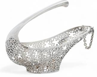 Lot 35 | Alex Styles for Garrard & Co. Ltd. (London) Sterling Silver Wine Cradle, 1978 H 7" W 3.3" L 9" 16.2t oz