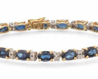 Lot 24 | 18k Yellow And White Gold, Sapphire And Diamond Bracelet L 7"