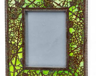 Lot 91 | Tiffany Studios (American) 'Grapevine' Etched Metal & Favrile Glass 947 Photo Frame, Early 20th C. H 9.5" W 8"