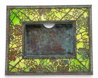 Lot 92 | Tiffany Studios (American) 'Grapevine' Etched Metal & Favrile Glass 939 Easel Calendar, Early 20th C. H 7.3" W 8.8"
