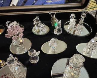 Large selection of Swarovski figurines and Christmas ornaments.