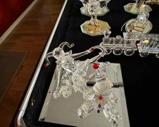 Large selection of Swarovski figurines and Christmas ornaments.