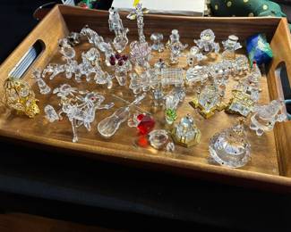 Large selection of Swarovski figurines and Christmas ornaments.
