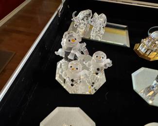 Large selection of Swarovski figurines and Christmas ornaments.