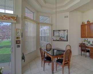 French Provincial kitchen table with cane back chairs