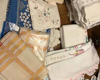 Huge selection of vintage tablecloths, pillow cases, bedspreads. Battenburg lace tablecloth with matching napkins