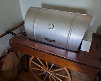 One of a king grill with rotisserie.