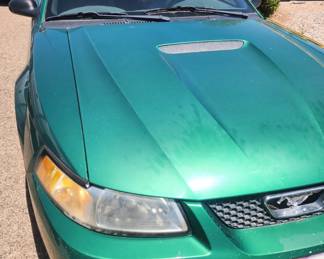 Hood of Ford Mustang. Year and mileage will be provided once available. Picture 1 of 2.