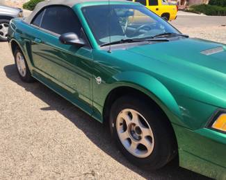 Side view of Ford Mustang. Mileage and year provided once available. This is picture 2 of 2 of this fabulous pre-owned car that needs a new home.