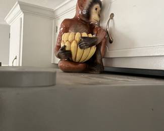 Ceramic monkey with removable ceramic banana basket