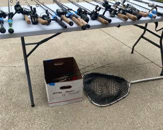Numerous fishing rods and reels; ice fishing gear; net