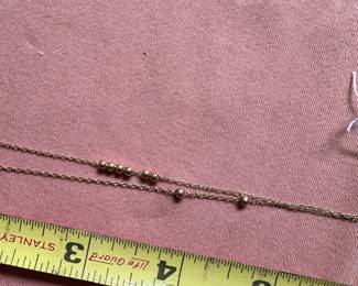 #94 - $50 - 14 kt gold chain with 9 beads 3 gr 14 in chain
