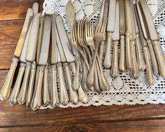 #16 - $550 - Monogram Sterling flatware by W.O 12dinner knives, 12 lunch knives, 1 master butter knife, 12 forks 16.33 oz