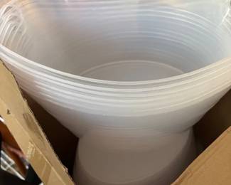 Box of plastic wine caddies.