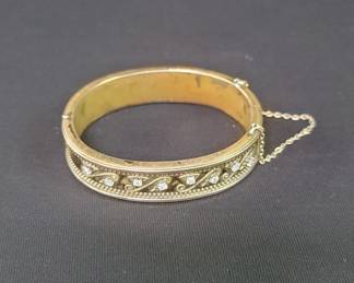 Gold, Brass and copper bracelet with eight diamonds, scratch tested for 10k gold, 24.6g, 2.5"diam.