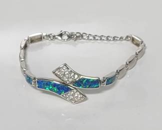 Sterling silver adjustable bracelet with clear stones and blue and green glass