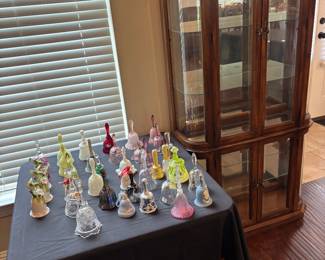 Very nice curio cabinet (lighted) …huge collection of bells…some are Fenton