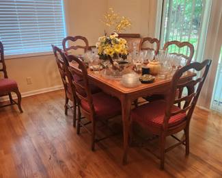 Country French dining table and eight chairs with a parquetop two leaves and table pads