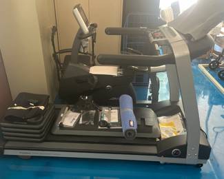 Side view of treadmill and more work out supplies