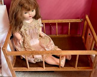 Porcelain Doll in Wood Crib