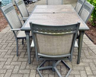 Outdoor Aluminum Cast Dining Table with Hard Surface and 6 Dining Chairs.