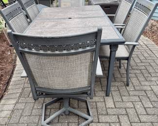 Outdoor Aluminum Cast Dining Table with Hard Surface and 6 Dining Chairs.