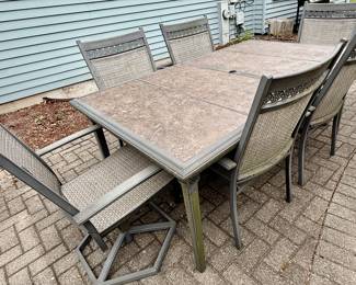 Outdoor Aluminum Cast Dining Table with Hard Surface and 6 Dining Chairs.
