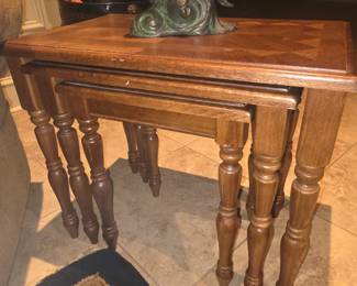 3 stacked curved leg tables