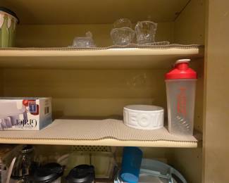 Kitchen: glass butter dish, sugar & creamer on top shelf;cat dish, cups & more