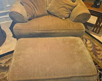 Stuffed lounge chair with cushions & stool