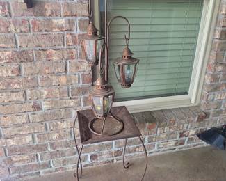 Outdoor triple lantern on metal table