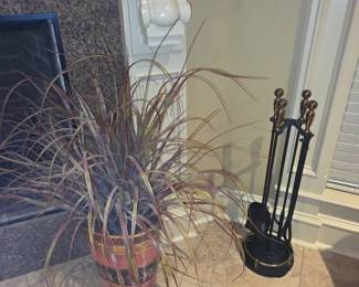 Plant with large urn + fireplace tools